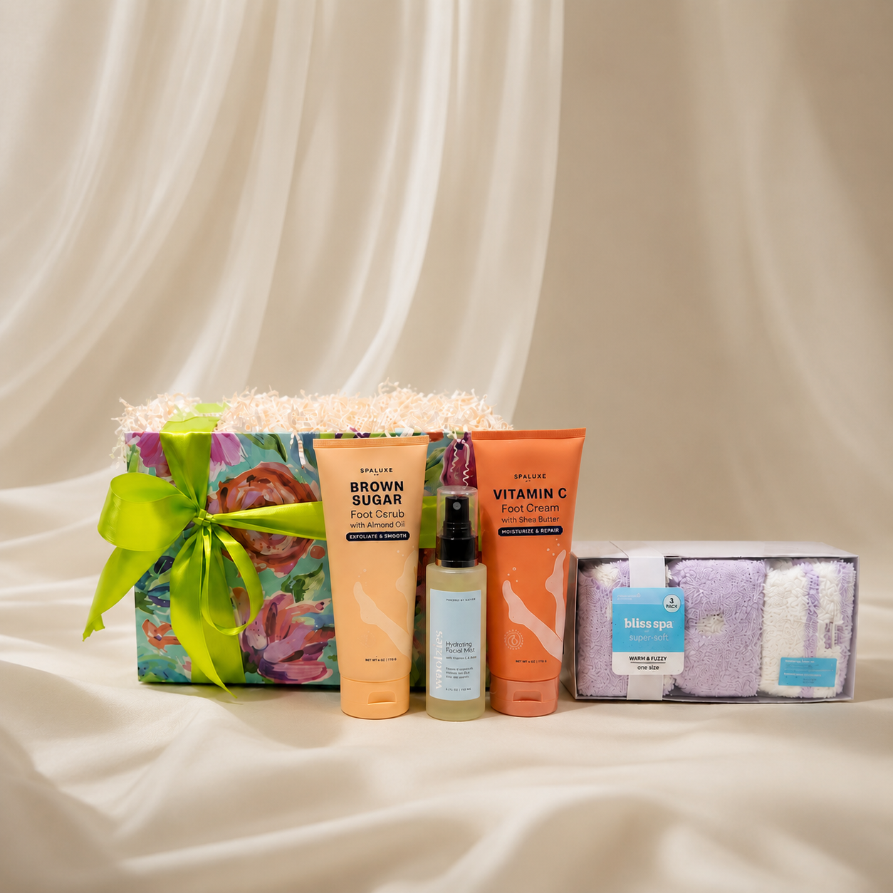 A curated self-care gift set includes a a brown sugar foot scrub with almond oil, a vitamin C with shea butter foot cream, a hydrating facial mist and warm fuzzy one-size socks.