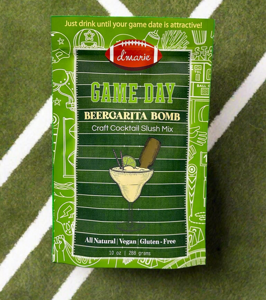 Packaged 'Game Day BeerGarita Bomb' cocktail mix on a green surface with white lines.