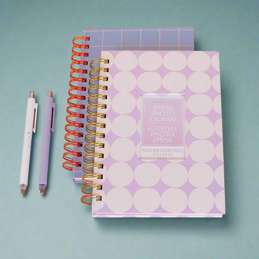 mini-instant-photo-journals with different designs on a light blue background