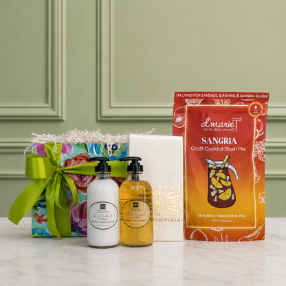 A housewarming curated gift collection including sea-salt citrus scented hand wash and lotion with bamboo tray, Moroccan pattern guest napkins and sangria cocktail slush mix. Beautifully arranged in a floral gift box with a satin ribbon.
